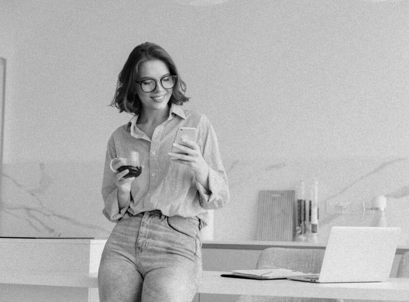 Portrait of a happy attractive woman using mobile phone